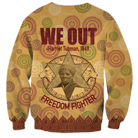 Beige We Out sweatshirt with Freedom Fighter text and colorful circular pattern cuffs hem