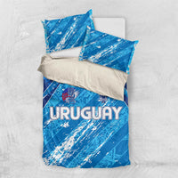 Sky blue bedding set with duvet and pillowcases showing URUGUAY crest and lettering