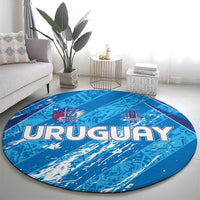 Sky blue round Uruguay rug with 'URUGUAY' lettering and Uruguay crest