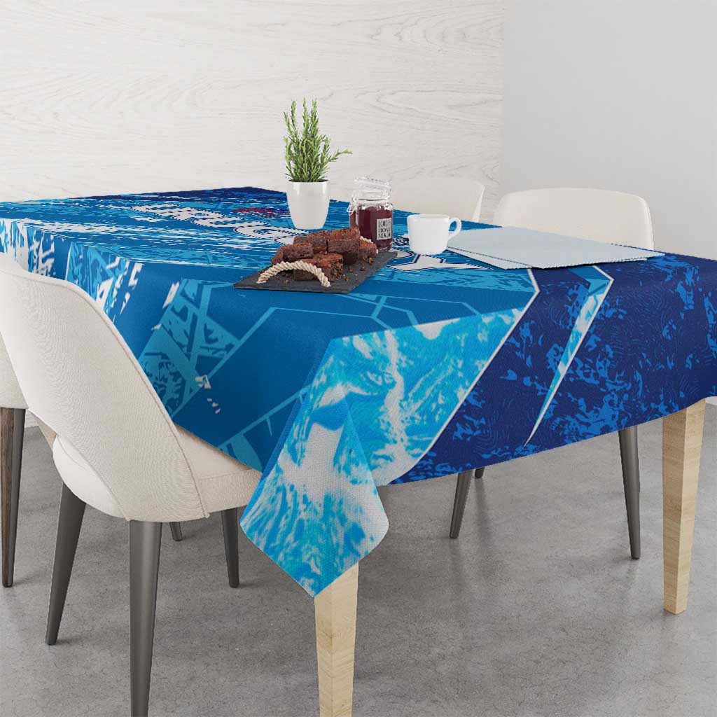 Sky blue football tablecloth on square dining table, corner drape over edge