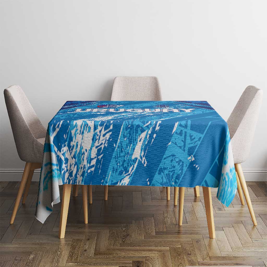 Sky blue tablecloth with football graphic pattern, spread neatly on dining table