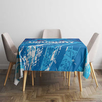 Sky blue tablecloth with football graphic pattern, spread neatly on dining table