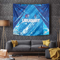 Sky blue Uruguay football tapestry with “URUGUAY” lettering, crest, and geometric pattern