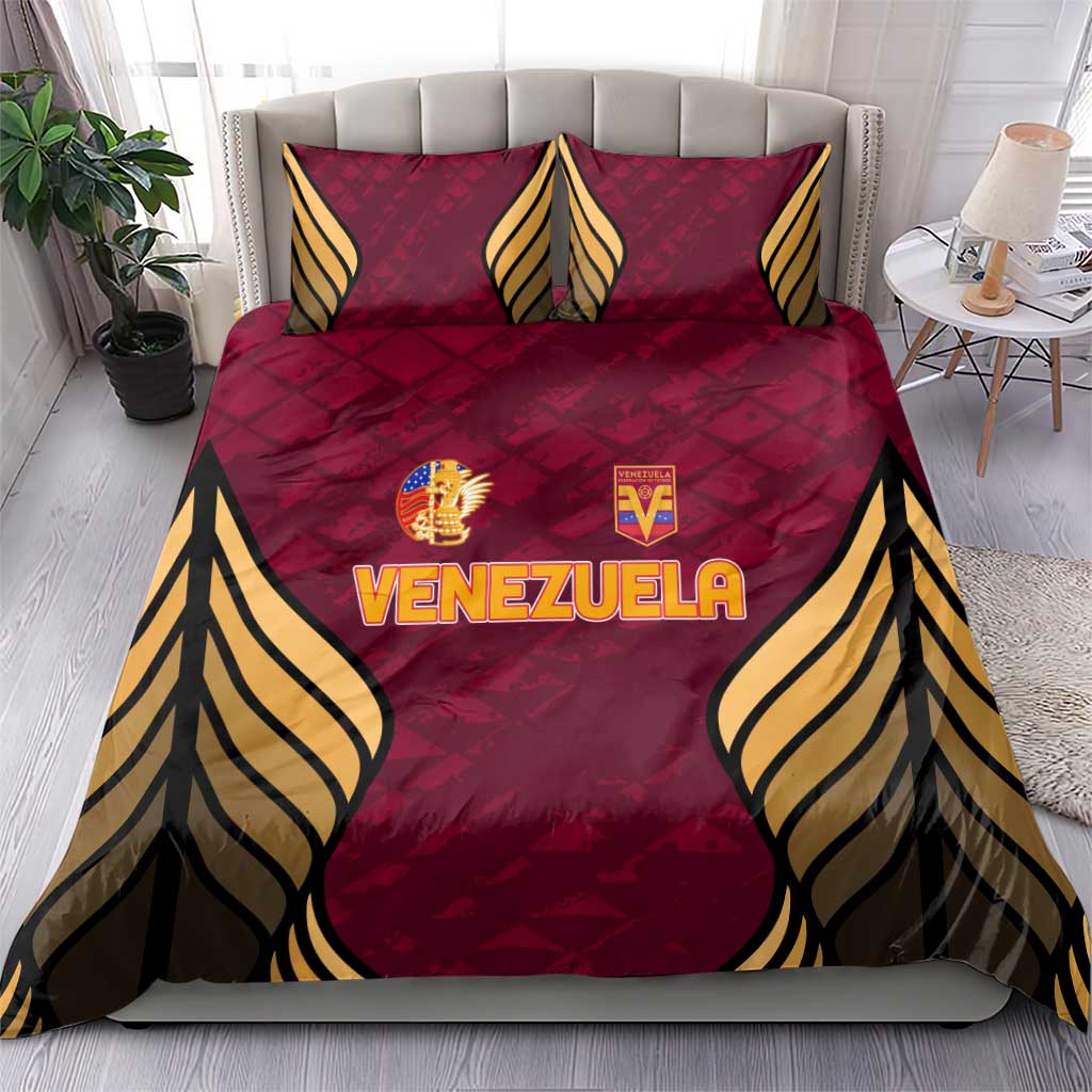 Maroon Venezuela football bedding set on bed with two matching pillows and wing trim