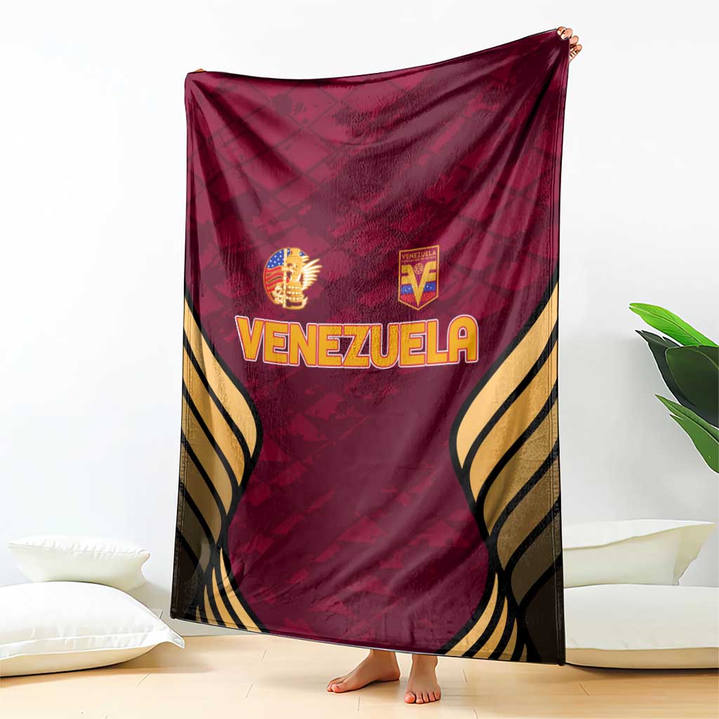 Wine-red Venezuela football blanket with large “VENEZUELA” lettering and gold trim