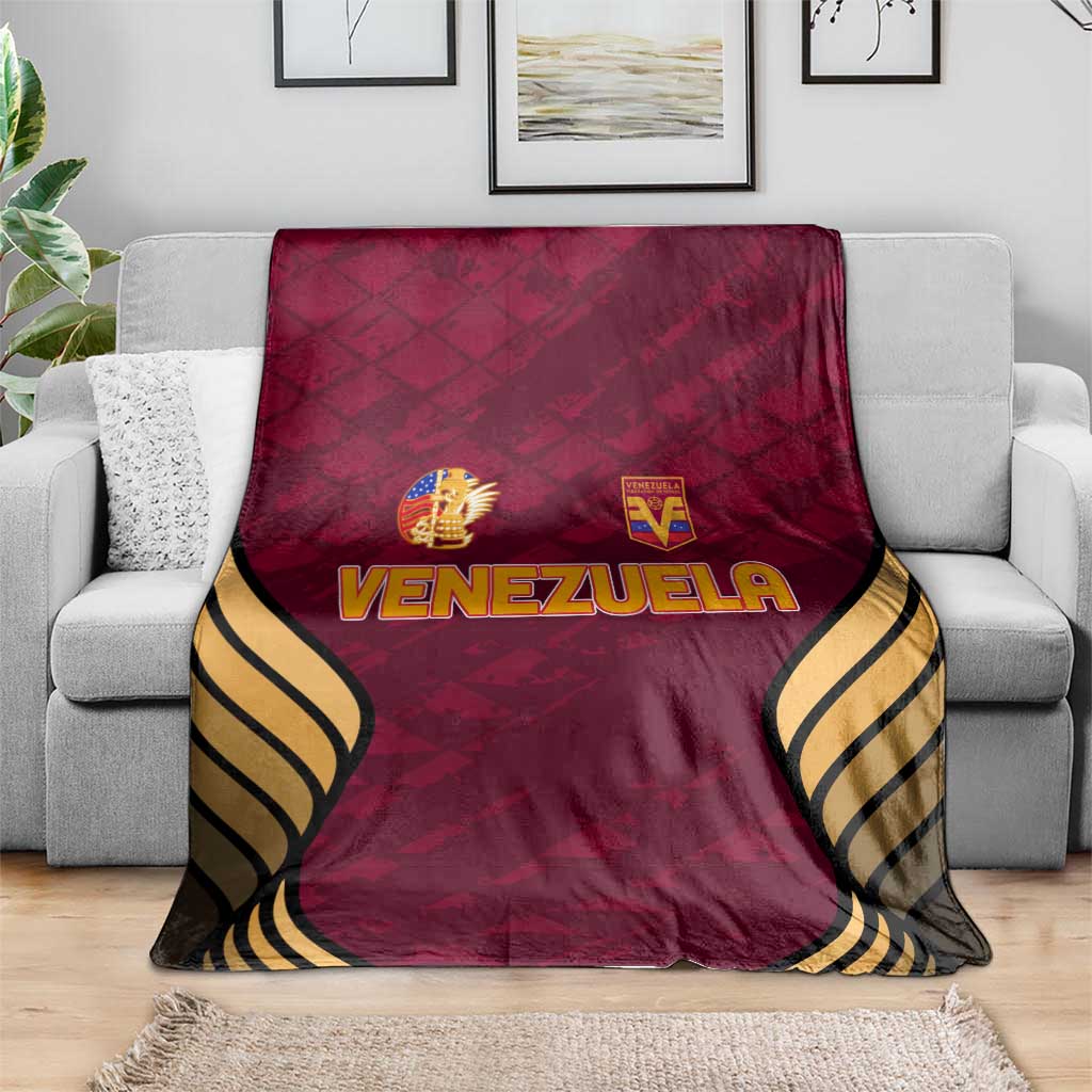 Wine-red Venezuela football blanket with crest logos and black-and-gold wave trim
