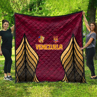 Venezuela football quilt spread in yard, dark red with centered Venezuela crest and wings