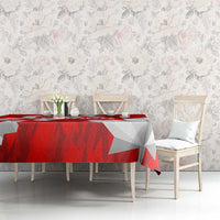 Red and white geometric Canada-themed tablecloth covering dining table