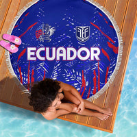 Blue round beach blanket with Ecuador crest, bold Ecuador lettering, white fringe edging