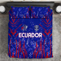 Blue duvet and pillowcases with red abstract print and 'ECUADOR' text in white