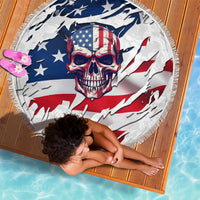 Round skull American flag beach blanket shown flat with white fringe edge.