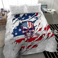 White bedding set featuring skull in an American flag with blue and red drape, two pillows