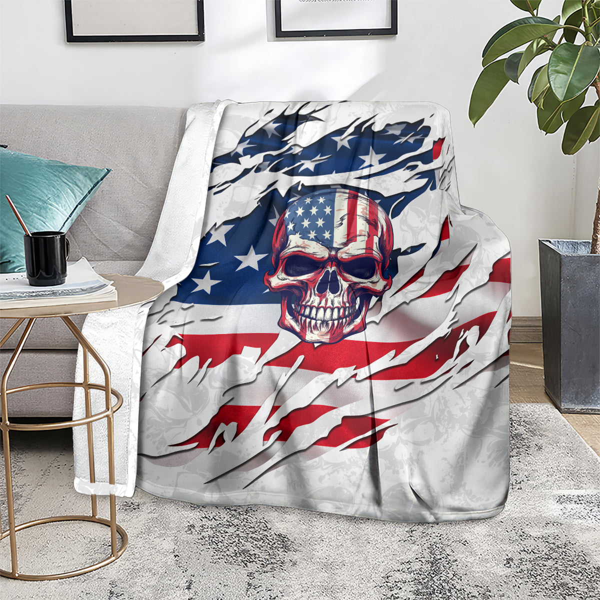 American flag skull graphic throw blanket folded on floor, white with blue and red flag design