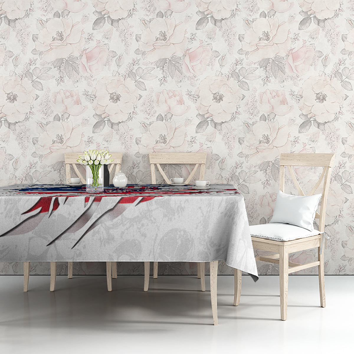 White tablecloth with American flag skull print, draped over table with chairs around