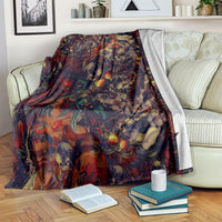 Red skull art blanket partially covering a couch with bold skull and floral pattern