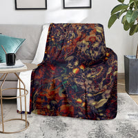 Red skull-themed throw blanket with colorful skulls and plants draped over a chair