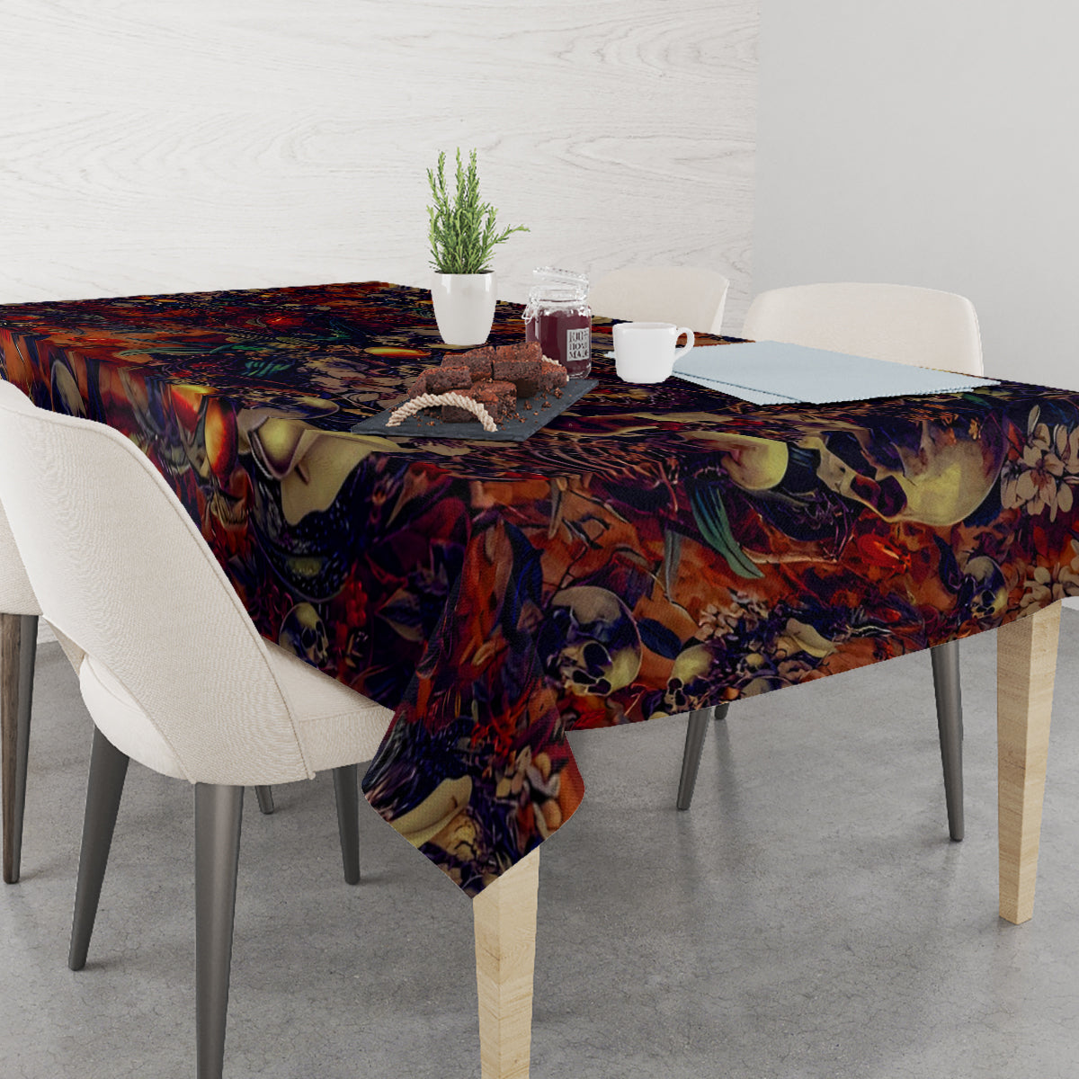 Skull art tablecloth DT02 draped over dining table corner, skull and floral print