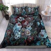 Green bed set with skull, roses, and teal floral print; two matching pillowcases