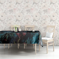 Dark floral tablecloth with teal-blue blooms, red accents, and skull motifs on table