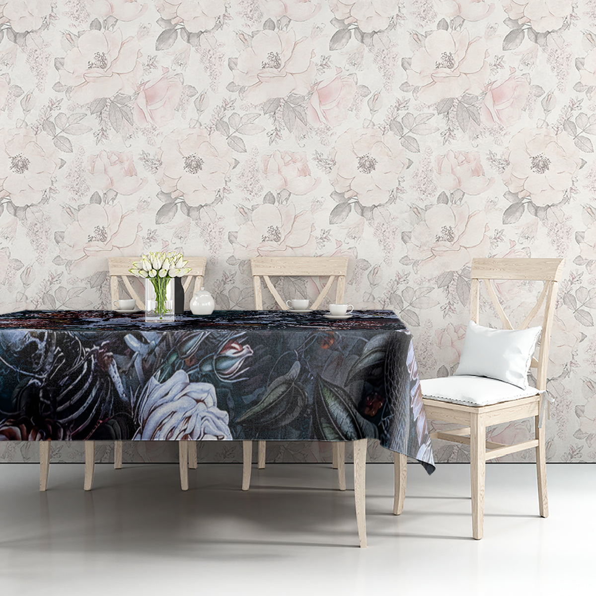 Black tablecloth with skull-and-flower design on dining table