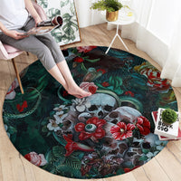 Round green floral rug with central animal-face motif and red flower accents