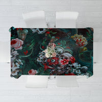 Green floral tablecloth with dark leaves and rose design, rectangular shape