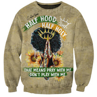 Beige crewneck sweatshirt with large front graphic of praying hands and sunflowers