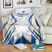 France football blanket, blue wing pattern with France Eur 2024 crest, on sofa