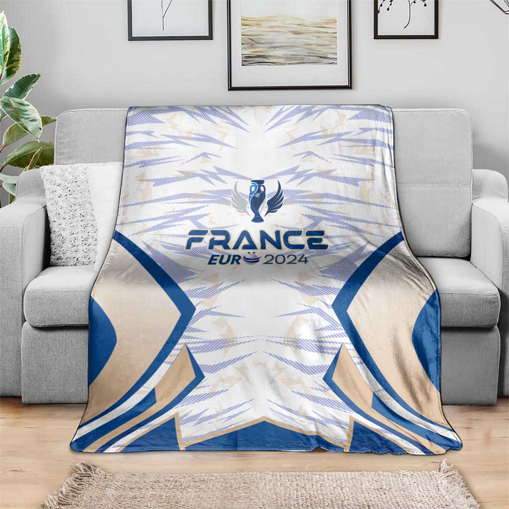 France football blanket with blue wing design and France Eur 2024 crest, on couch