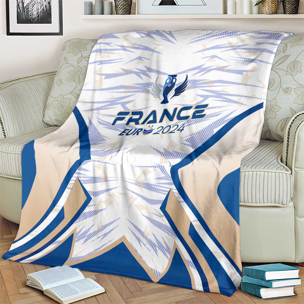 France football blanket, blue and white wing pattern with France Eur 2024 crest, on armchair
