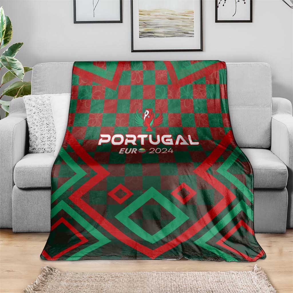 Portugal football blanket on sofa, green/red geometric check with 'PORTUGAL EUR 2024'.