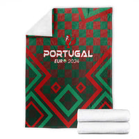 Portugal football blanket folded with green/red check pattern and 'PORTUGAL EUR 2024'.