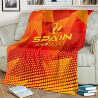 Spain football blanket on armchair, red-orange pattern with SPAIN EURO 2024 emblem