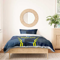 Blue bedding set with 'SCOTLAND EUR 2024' crest, yellow V-shaped graphic and patterns