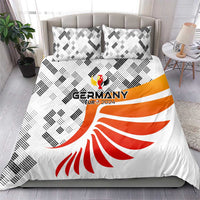 Germany bedding set on a bed: white duvet with orange-red eagle emblem and black shapes