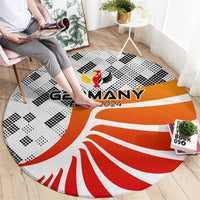 Round Germany 2024 rug with orange-and-white flag waves and dotted pattern
