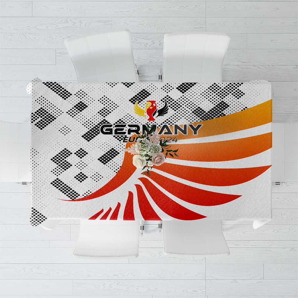 White tablecloth with Germany 2024 crest and red-orange stripes, black check pattern