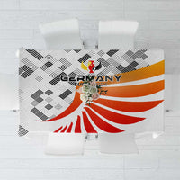 White tablecloth with Germany 2024 crest and red-orange stripes, black check pattern