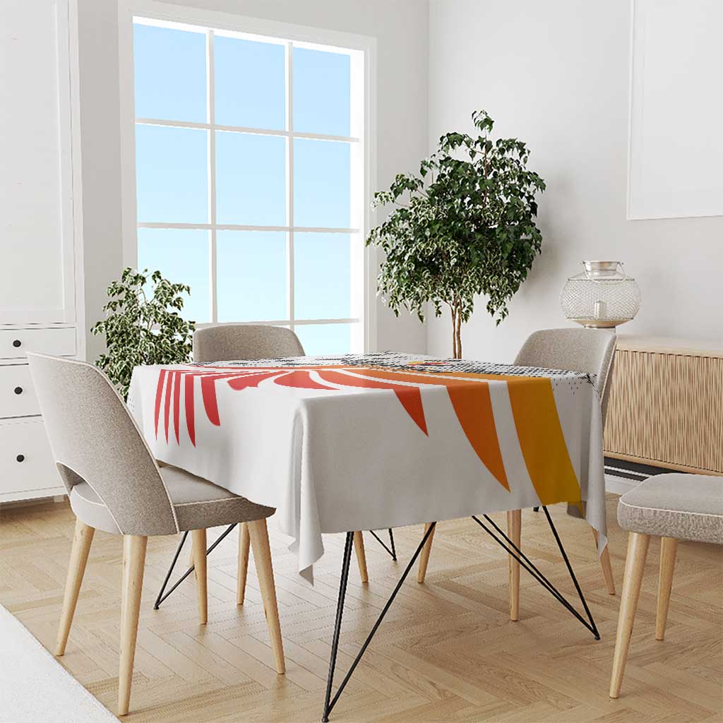 White tablecloth with red and orange swirl football graphic, wing-style design