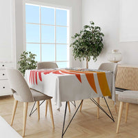 White tablecloth with red and orange swirl football graphic, wing-style design