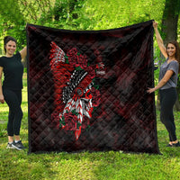 Black quilt with red skull, feather and roses graphic, shown spread outdoors.