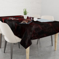 Black tablecloth on dining table with red skull and rose design across center