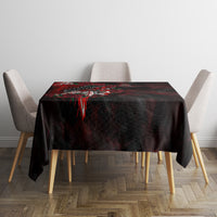 Black square tablecloth with red skull, feather and rose graphic, corner-falling folds