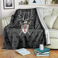 Black Knights Templar warrior skull blanket draped on a couch with shield and sword artwork