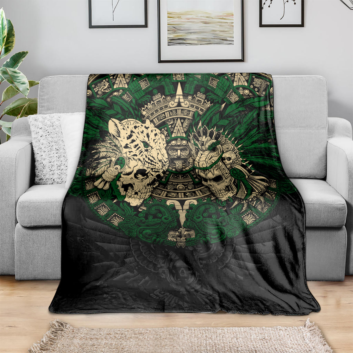 Black and green Aztec warrior skull throw blanket spread on a sofa