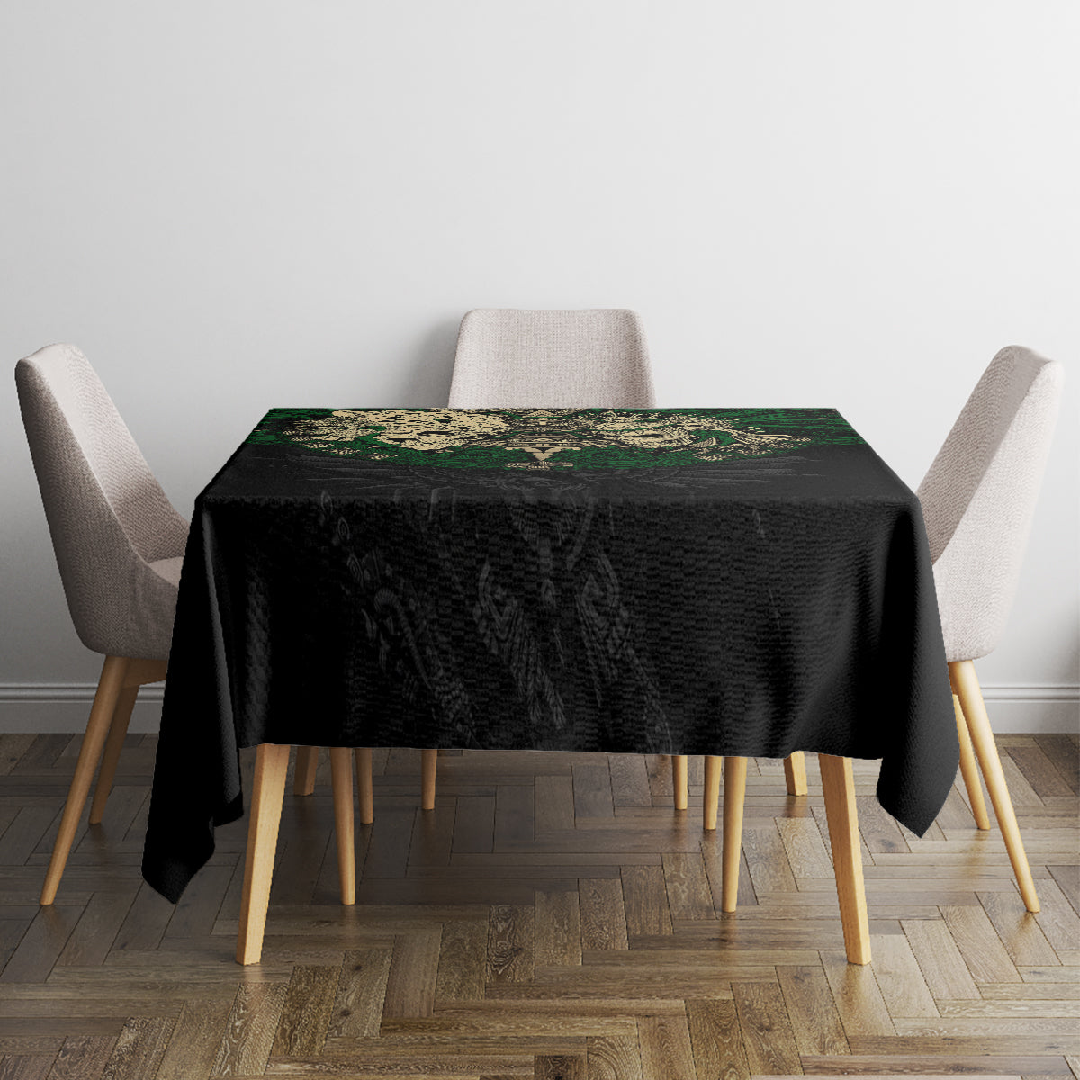 Black tablecloth featuring green Aztec skull warrior artwork centered on top