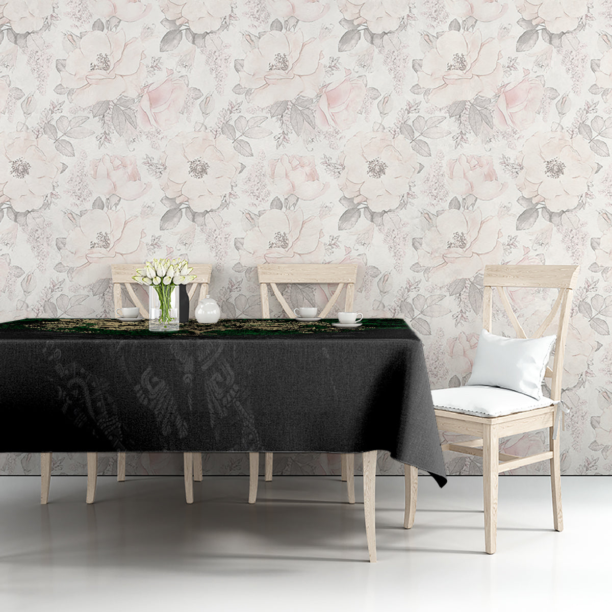 Black tablecloth with green Aztec skull warrior graphic along front edge