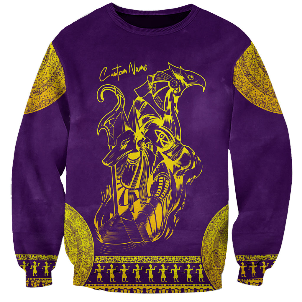 Unisex purple sweatshirt with gold Anubis/Horus graphic and Custom Name text.