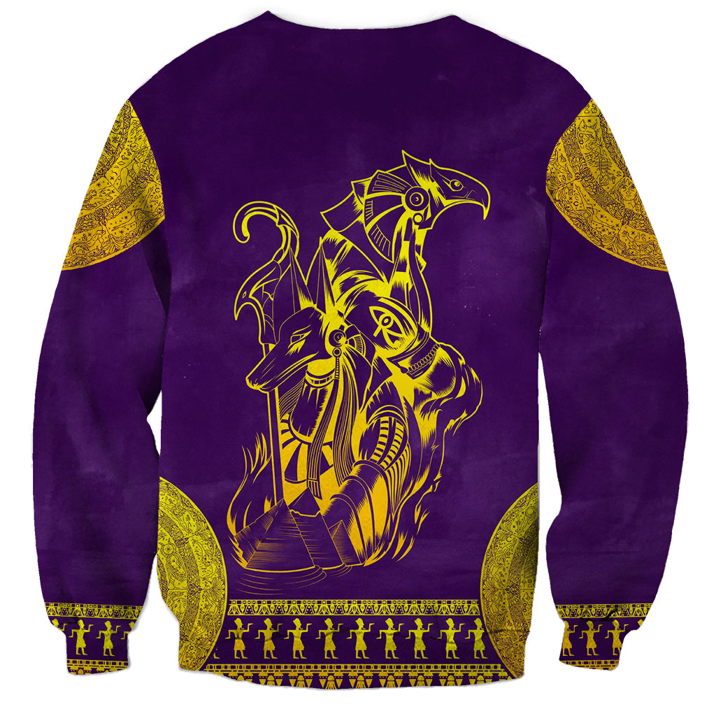 Unisex purple sweatshirt with gold Anubis and Horus graphic on back.