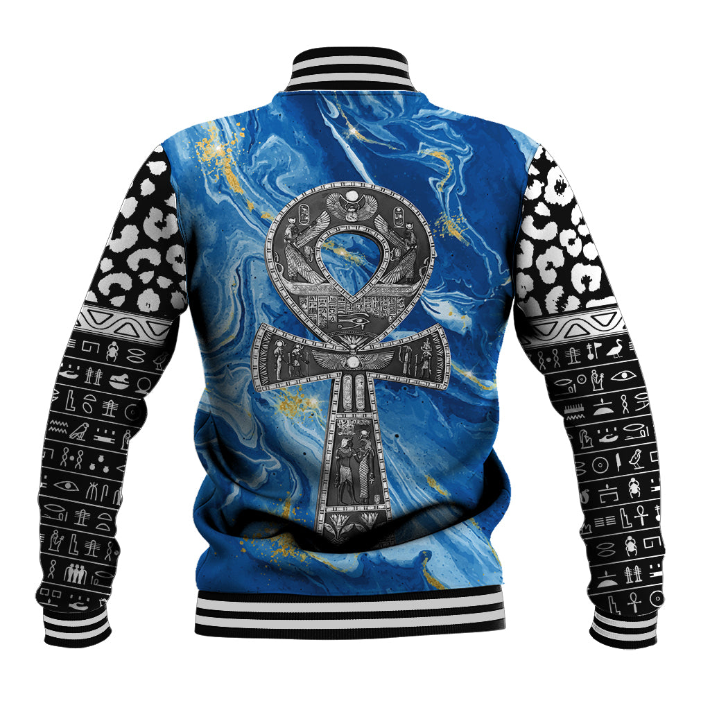 Blue baseball jacket back with large emblem and black-and-white patterned sleeves